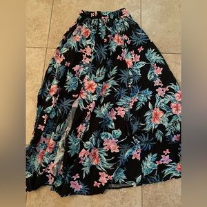 Long skirt with side slit.